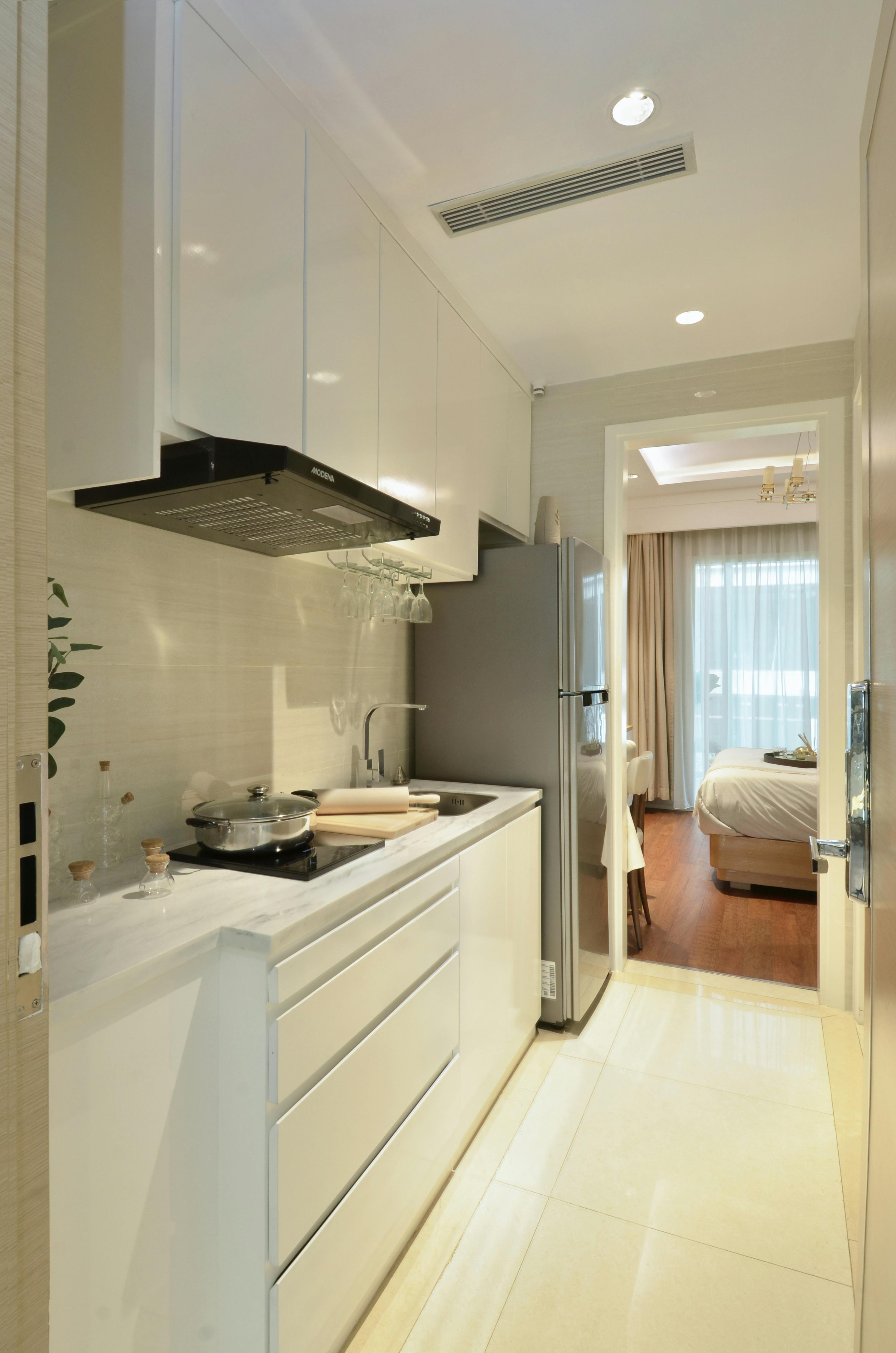 Modern kitchen opening into a bedroom